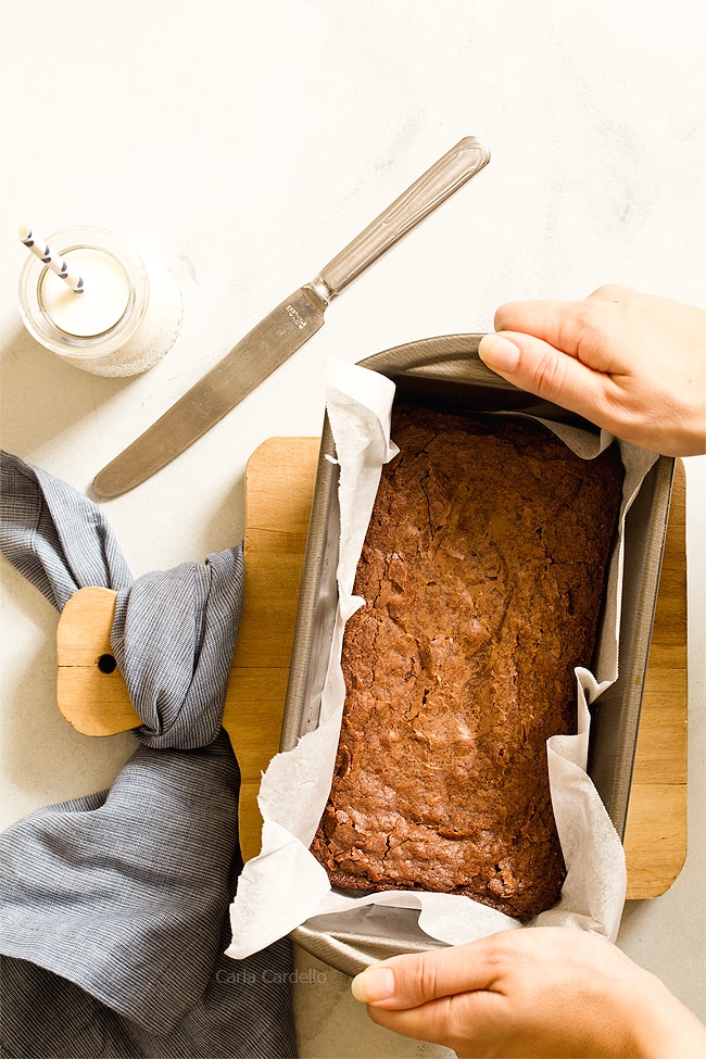 Small Batch Brownies in a loaf pan with parchment paper