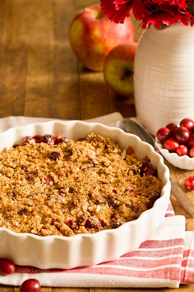 Stuck with extra cranberries and tired of cranberry sauce? Throw together this easy small batch Cranberry Apple Crisp with pecans. Warm and comforting in every bite!