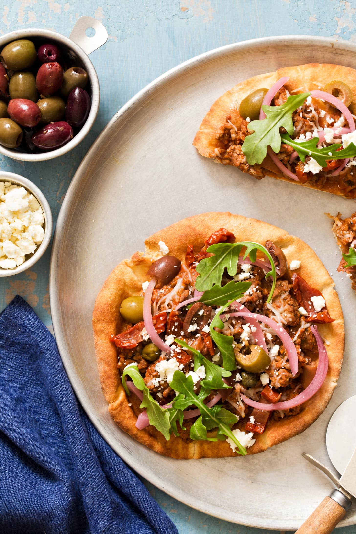Pita Bread Pizza with lamb, feta, and arugula