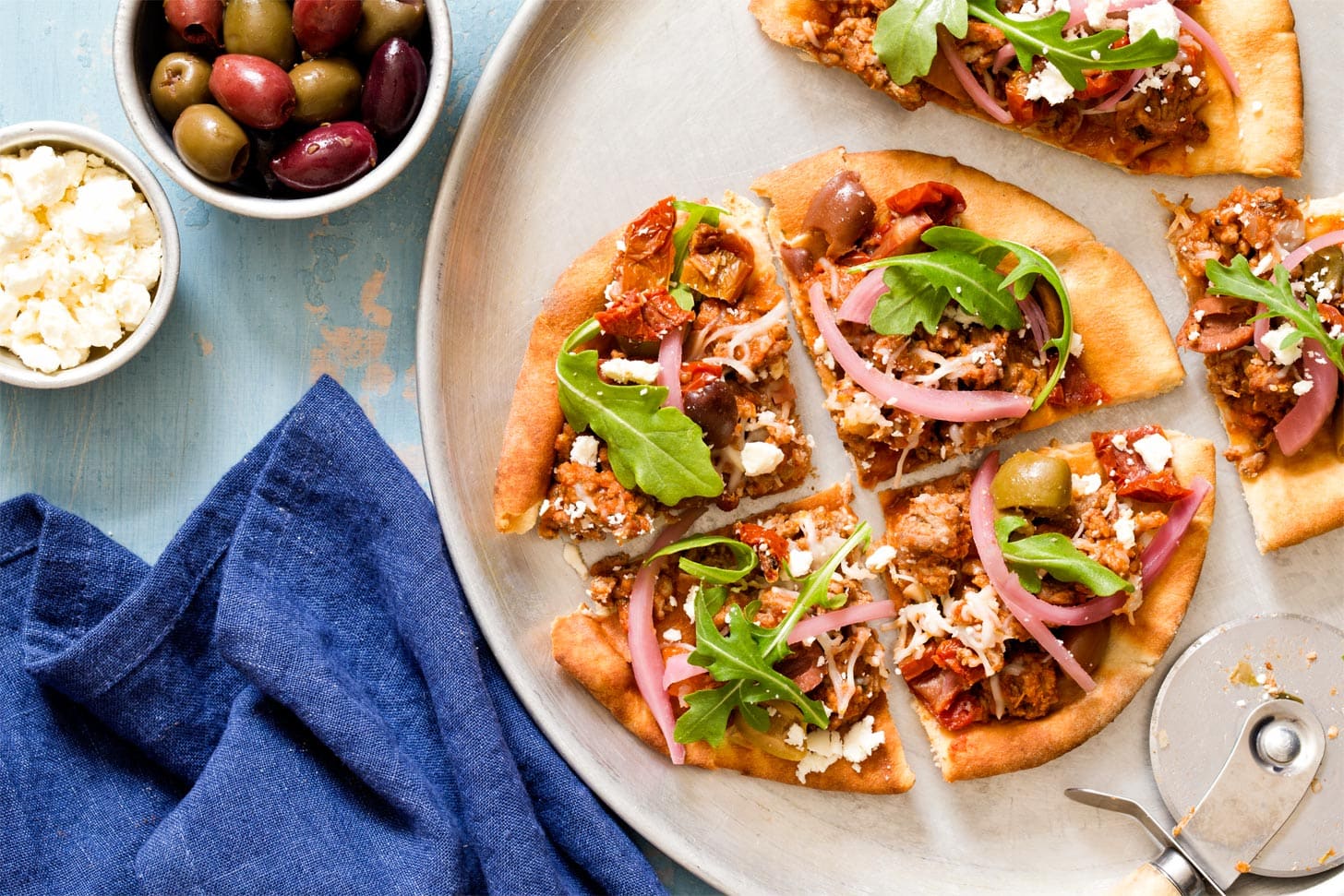 Pizza recipe with pita bread cut into slices