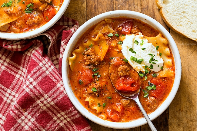 Lasagna soup in white bowl with spoon