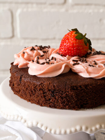 Close up of chocolate cake with pink frosting