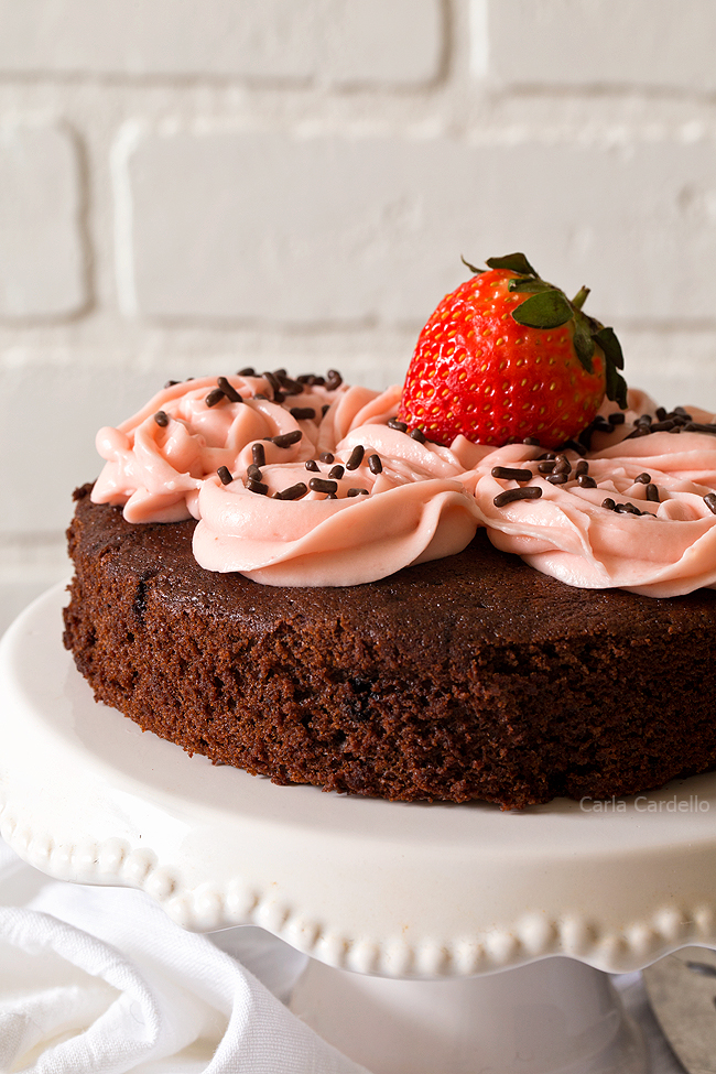 Close up of chocolate cake with pink frosting