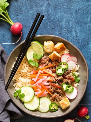 Slow Cooker Banh Mi Rice Bowls with pork, pickled vegetables, and baguette croutons.