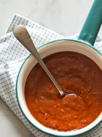 Learn how to make Homemade Red Enchilada Sauce from scratch using tomato sauce and fajita seasoning.