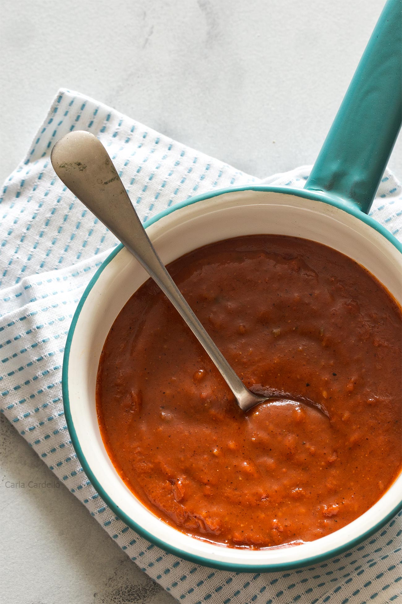 Learn how to make Homemade Red Enchilada Sauce from scratch using tomato sauce and fajita seasoning.