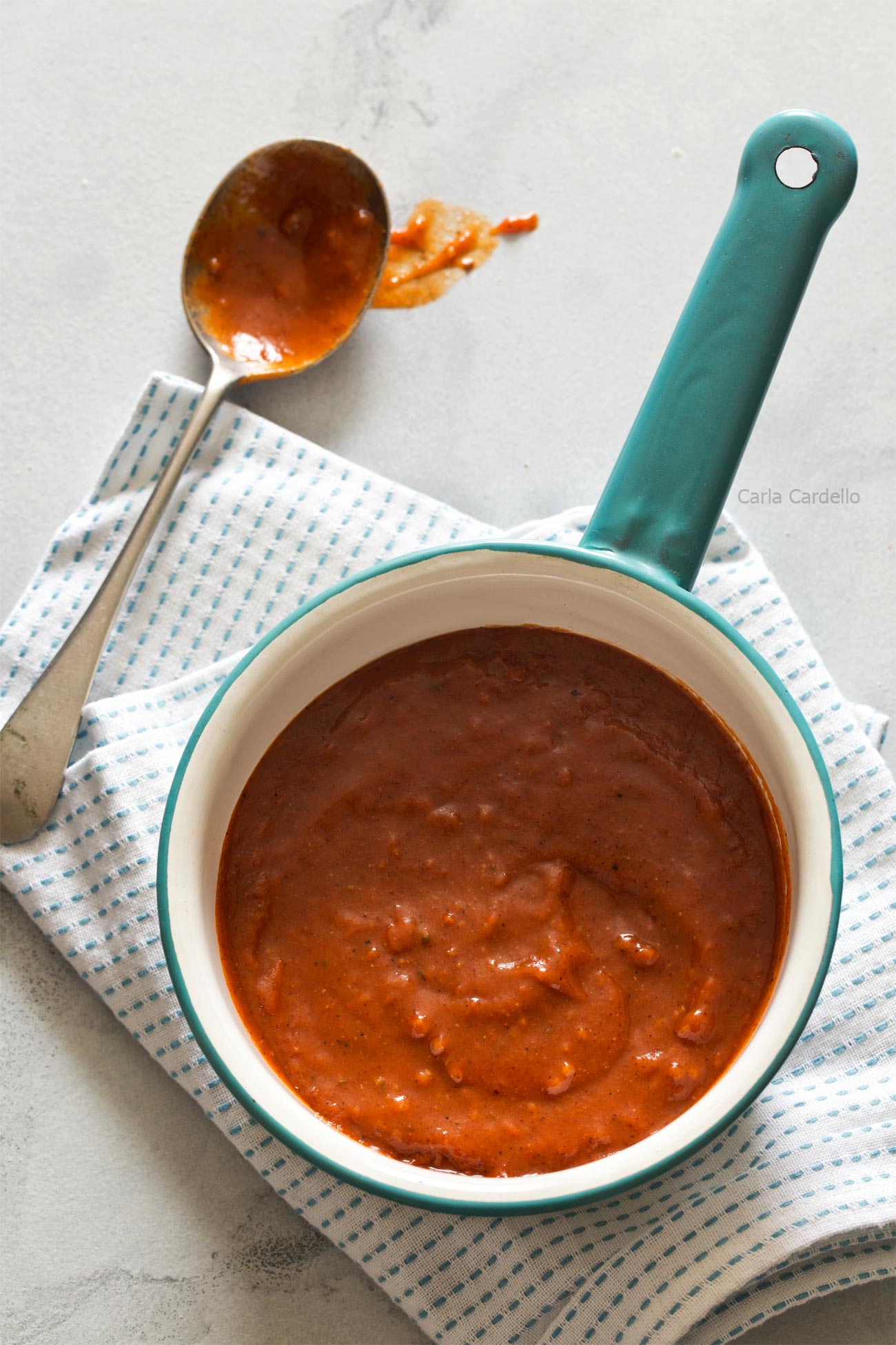 Learn how to make Homemade Red Enchilada Sauce from scratch using tomato sauce and fajita seasoning.