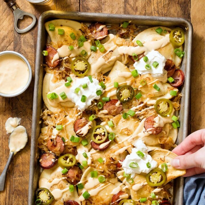 Recipe for Pittsburgh Pierogy Nachos with kielbasa, sauerkraut, and a homemade beer cheese sauce