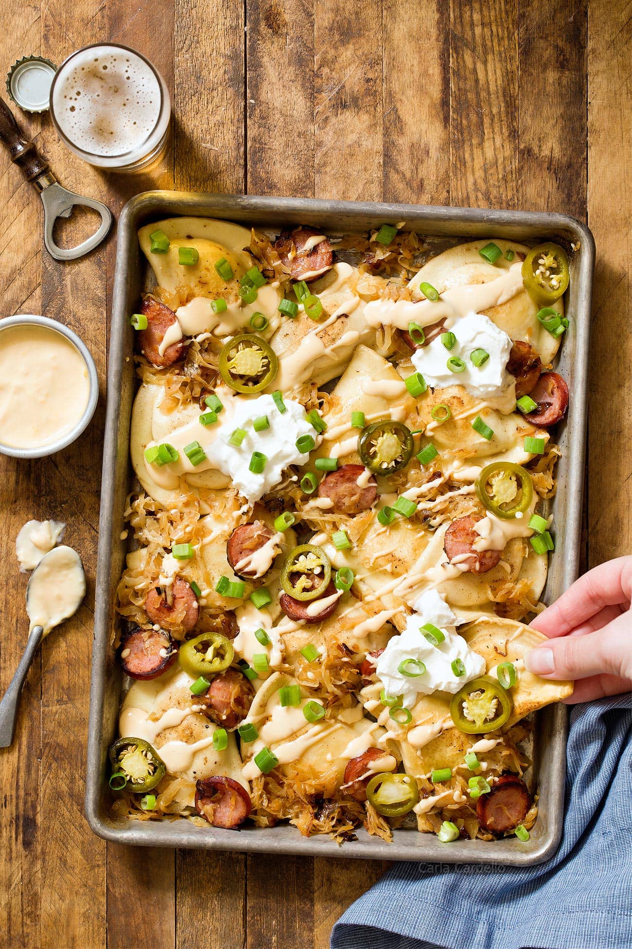 Recipe for Pittsburgh Pierogy Nachos with kielbasa, sauerkraut, and a homemade beer cheese sauce