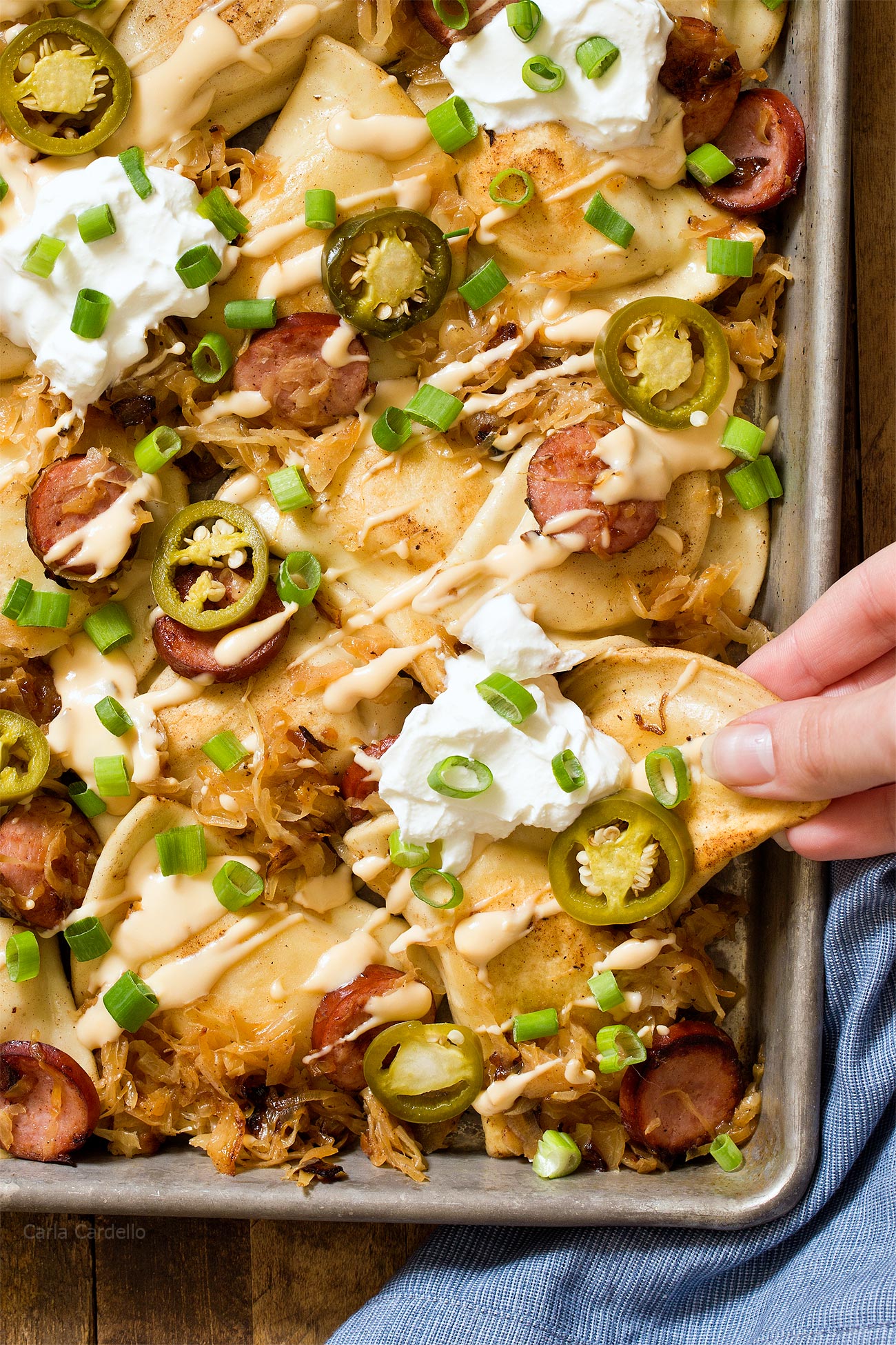 Pittsburgh Pierogy Nachos recipe with kielbasa, sauerkraut, and beer cheese sauce