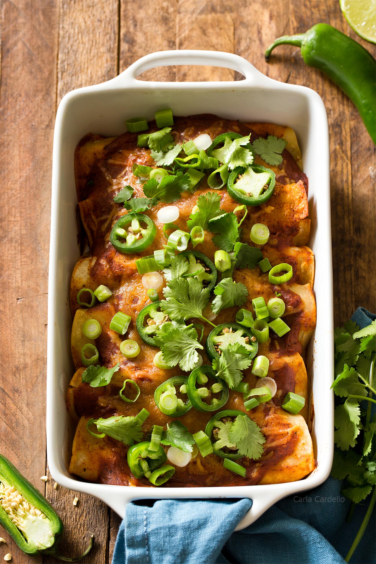 Beef Enchiladas in white casserole dish