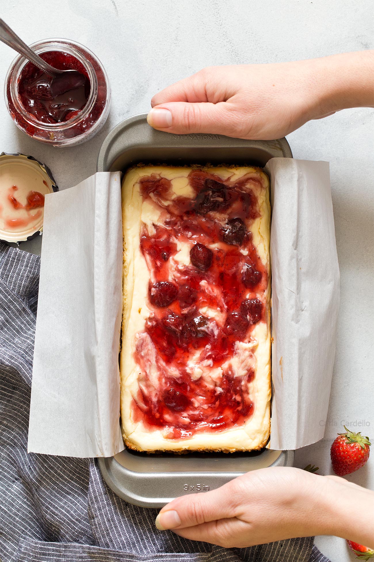 Small Batch Strawberry Swirl Cheesecake Bars baked in a loaf pan