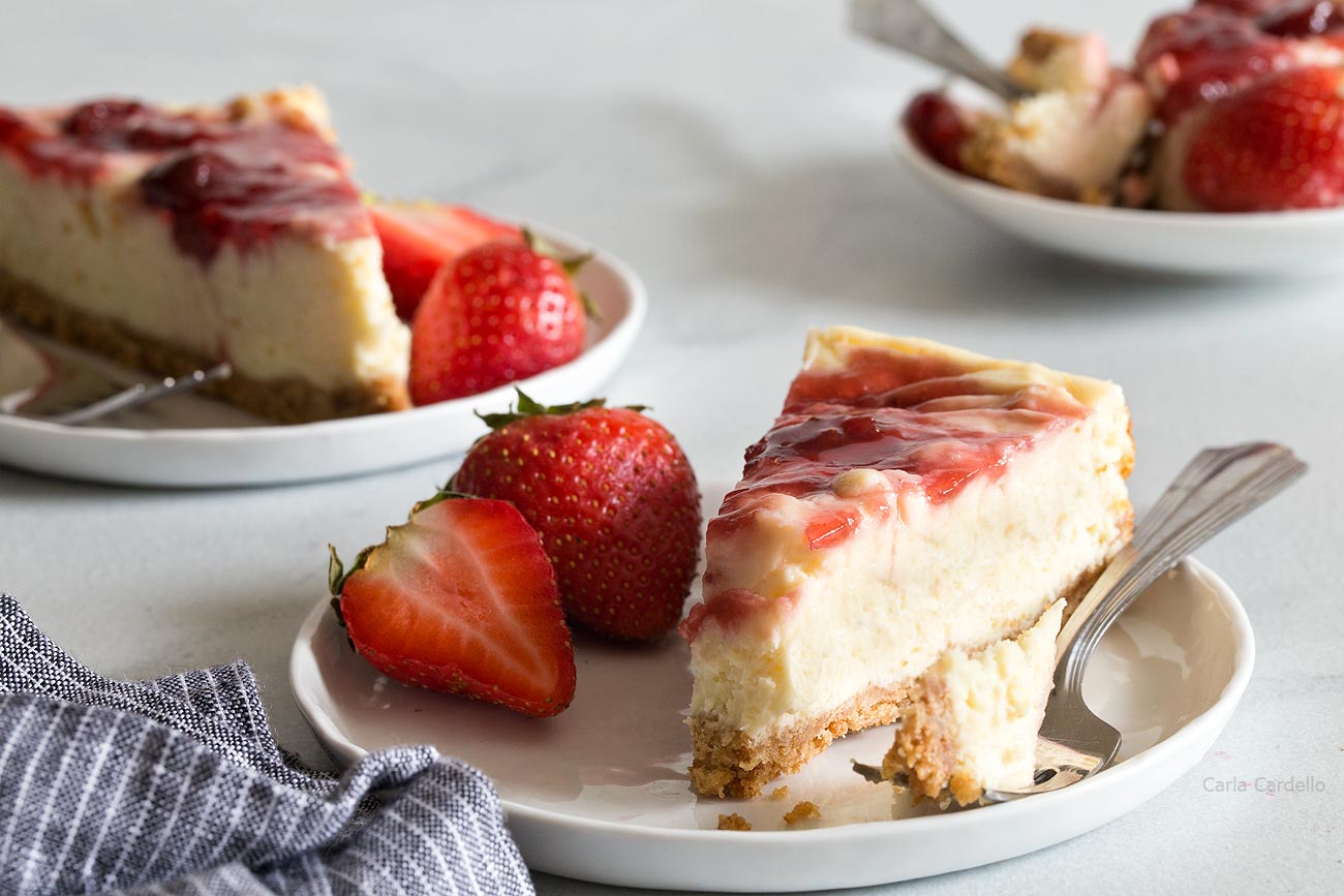 Slices of Small Batch Strawberry Swirl Cheesecake Bars 