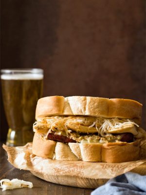 Polish Hill Pierogy Sandwich is Pittsburgh in a bite with kielbasa, pierogies, slaw, and beer mustard.
