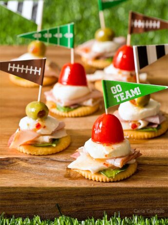 Antipasto Football Cracker Stacks with salami, turkey, ham, and mozzarella cheese