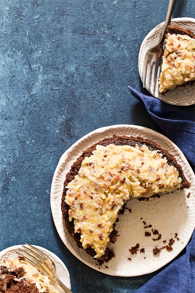Small German Chocolate Cake - Mamaw's German Chocolate Cake | southern discourse / This german chocolate cake has a gooey coconut and toasted pecan filling, a dark chocolate cake, and deliciously creamy chocolate buttercream on top!