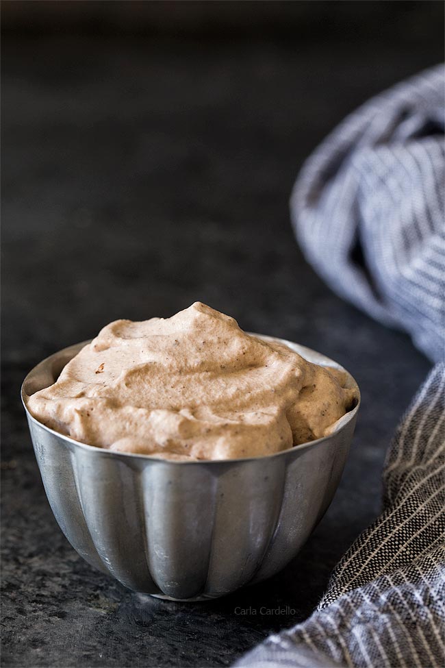 Small pewter bowl filled with chocolate whipped cream