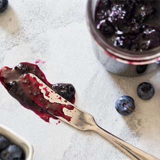 Knife with blueberry jam