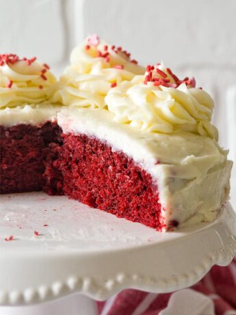 Close up of small red velvet cake on cake stand
