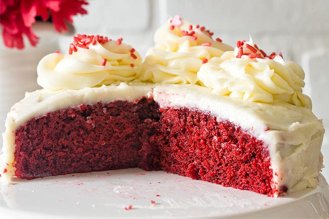 Close up of small red velvet cake on cake stand