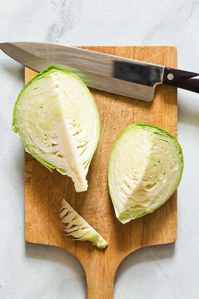 Cut each cabbage half in quarters