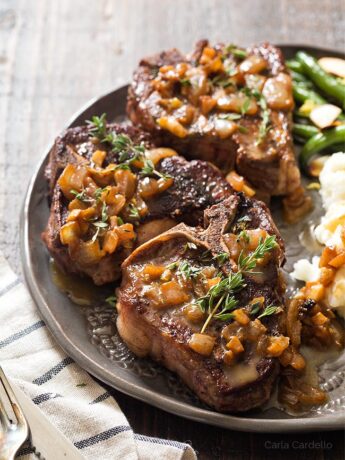 Lamb chops on plate with pan sauce
