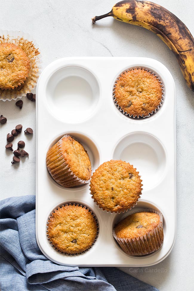 6 banana muffins with white muffin tray