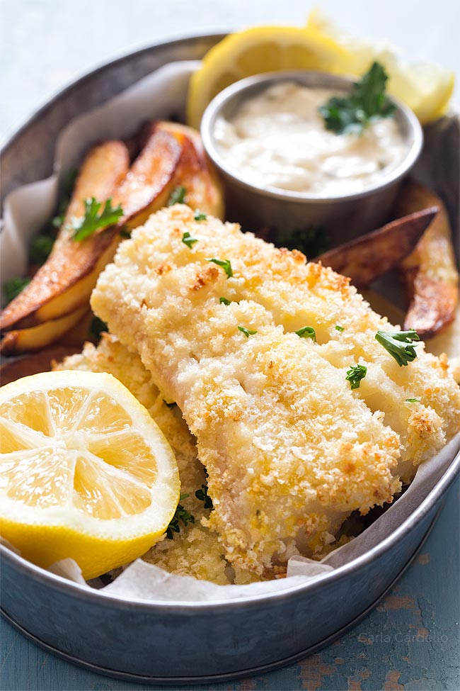 Close up of baked fish and chips in silver tin