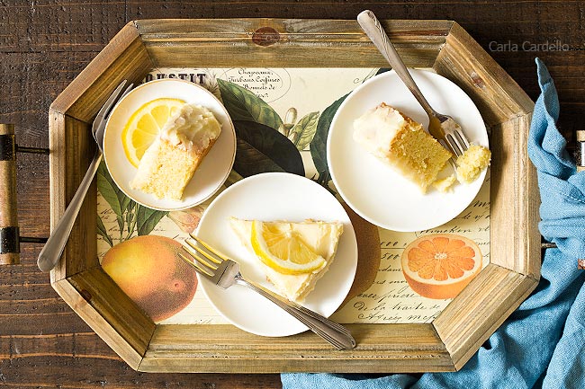 Slices of lemon cake on wooden tray