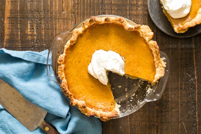 6 inch Pumpkin Pie in glass dish with slice missing