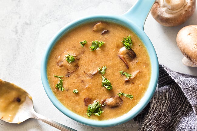 Blue bowl filled with brown mushroom gravy