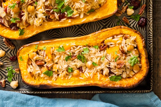 Close up of stuffed butternut squash half on baking sheet