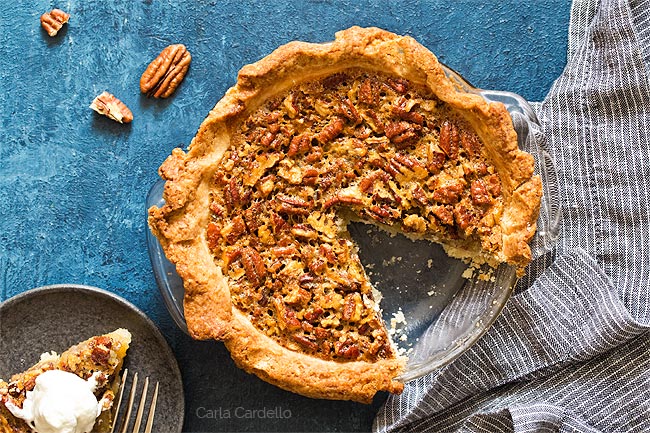 Overhead shot of pecan pie with slice missing