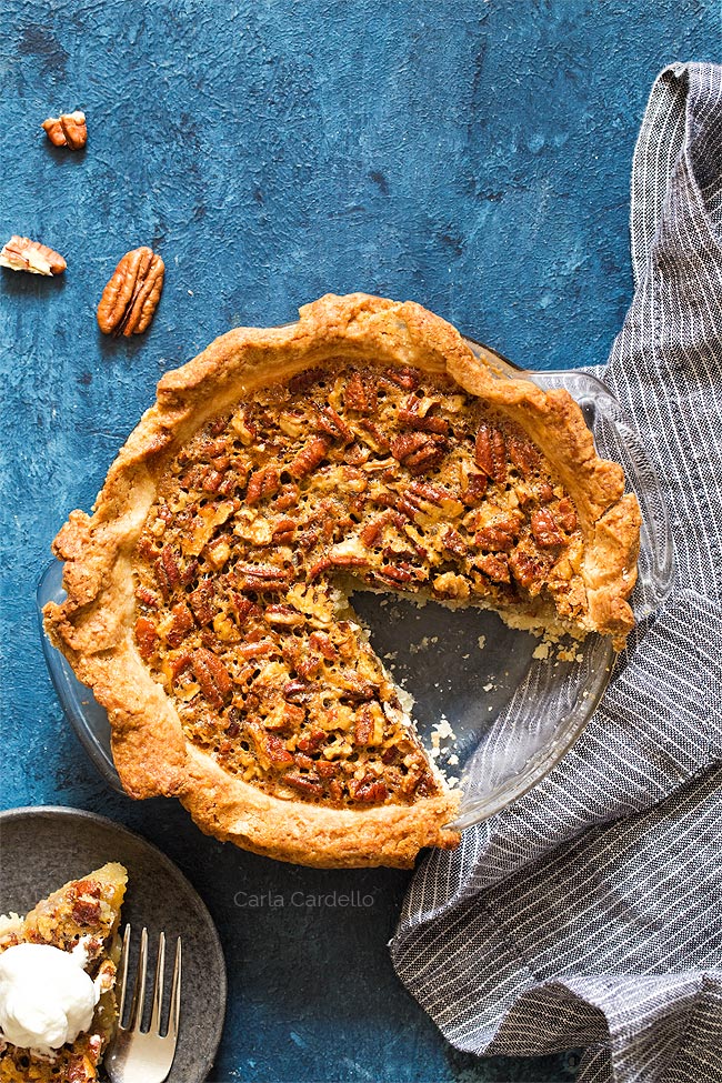 Overhead shot of pecan pie with slice missing