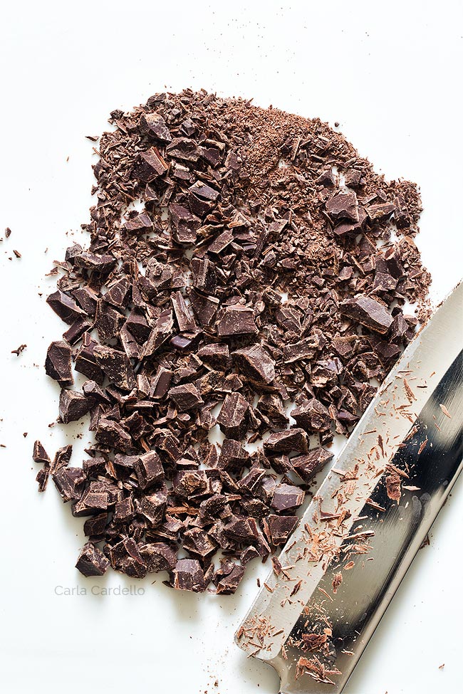 Chopped chocolate on cutting board with knife