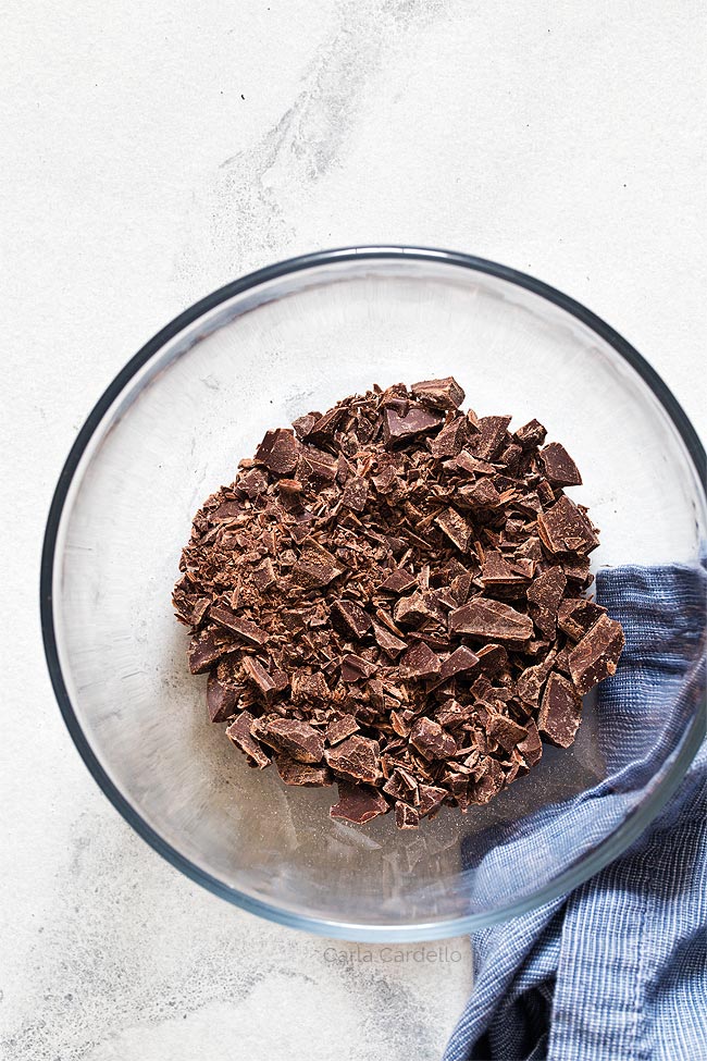 Chopped chocolate in glass bowl