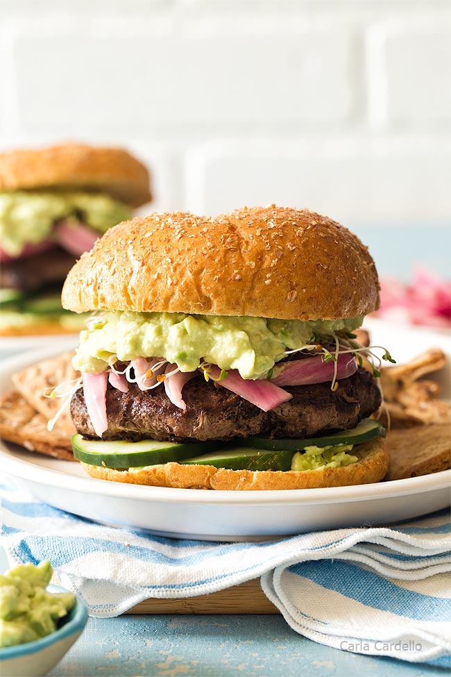 Avocado burger on white plate 