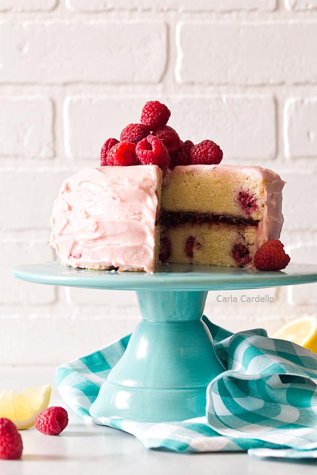 Lemon raspberry cake on turquoise cake stand