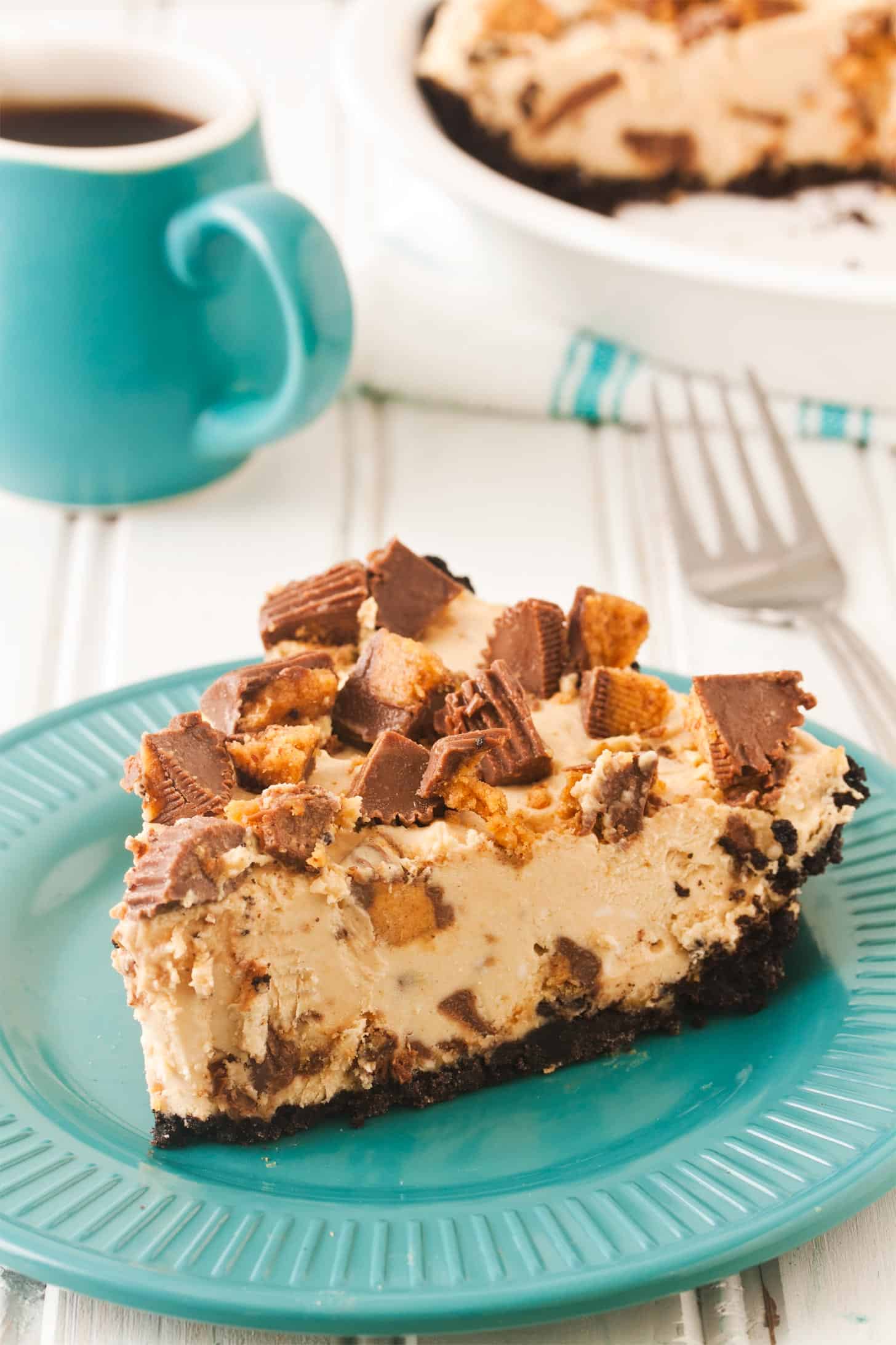 Slice of no bake peanut butter pie on teal plate