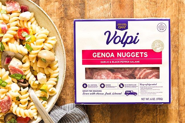 Volpi Salami in a box next to pasta salad