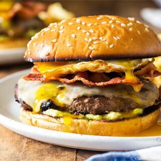 Breakfast burger on a plate with waffle fries