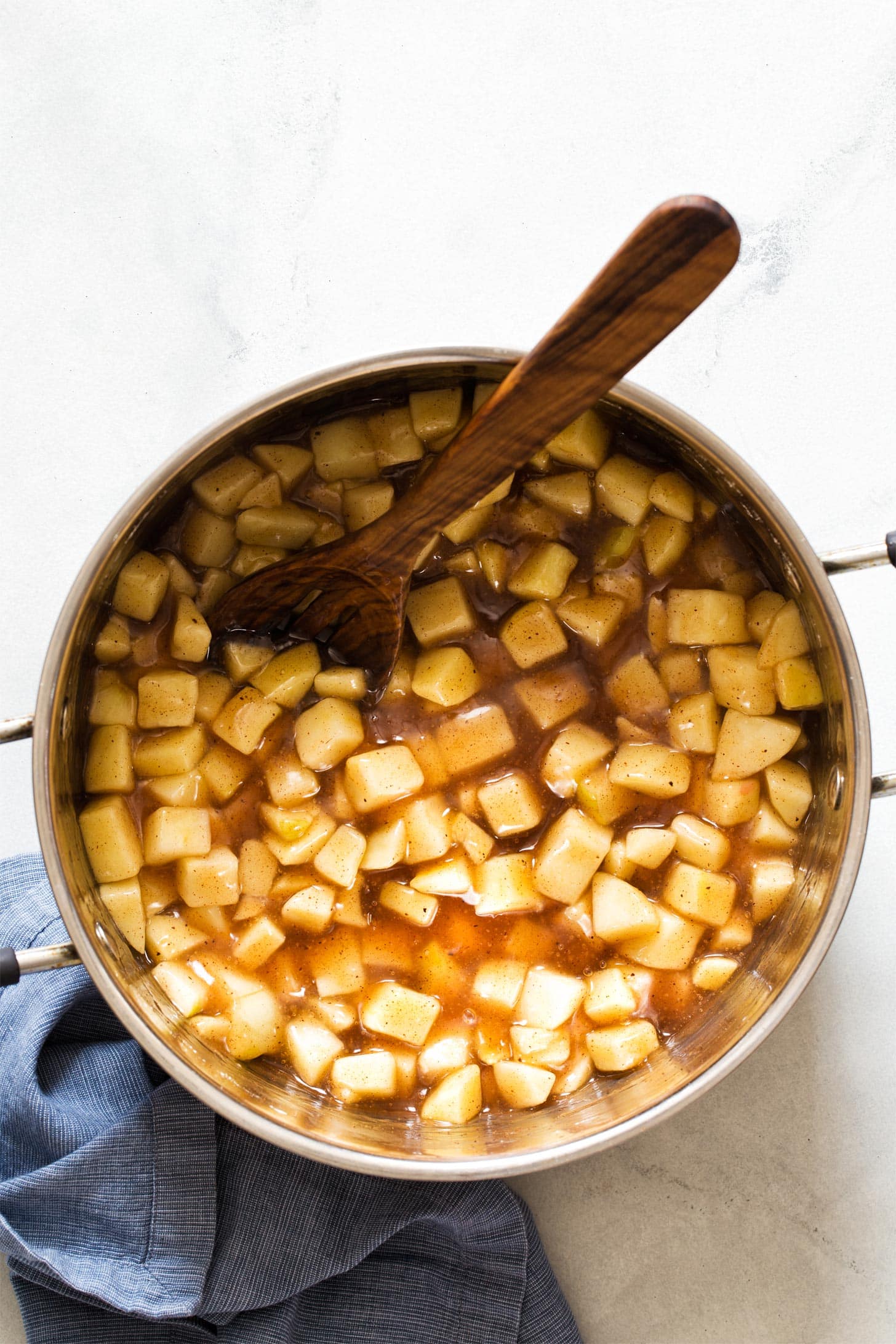 Cooked apple pie filling in a large pot