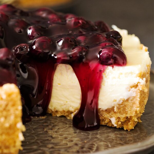 Close up of 7 inch cheesecake on a gray plate