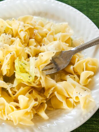 Close up of Haluski (aka cabbage and noodles) with fork