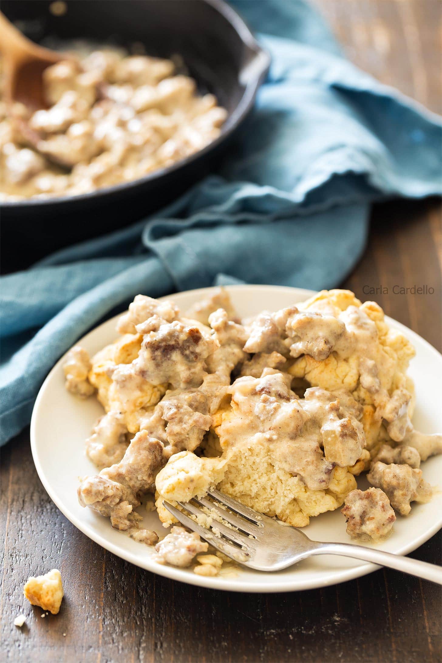 Sausage gravy poured over biscuits