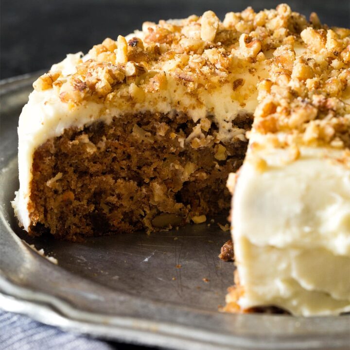 Frosted carrot cake on silver plate