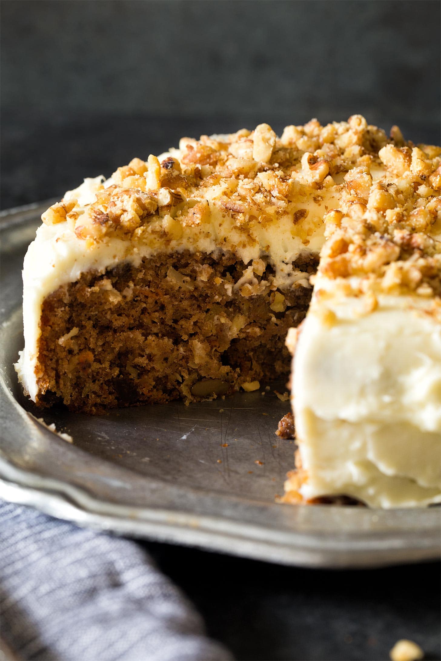 Frosted carrot cake on silver plate