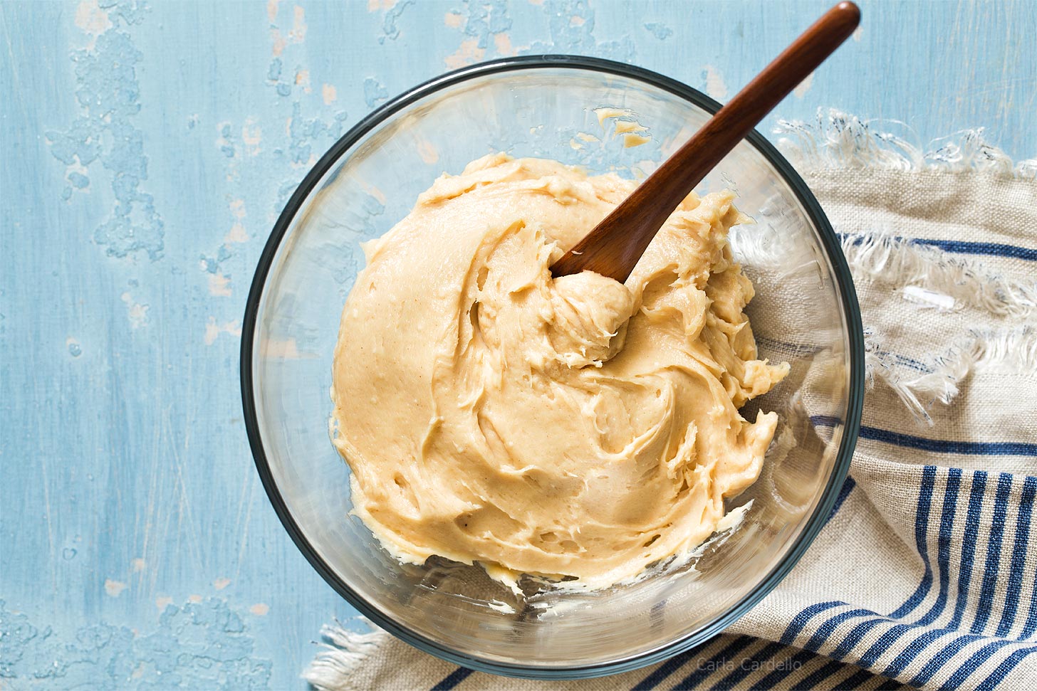 Glass bowl with cream cheese peanut butter frosting