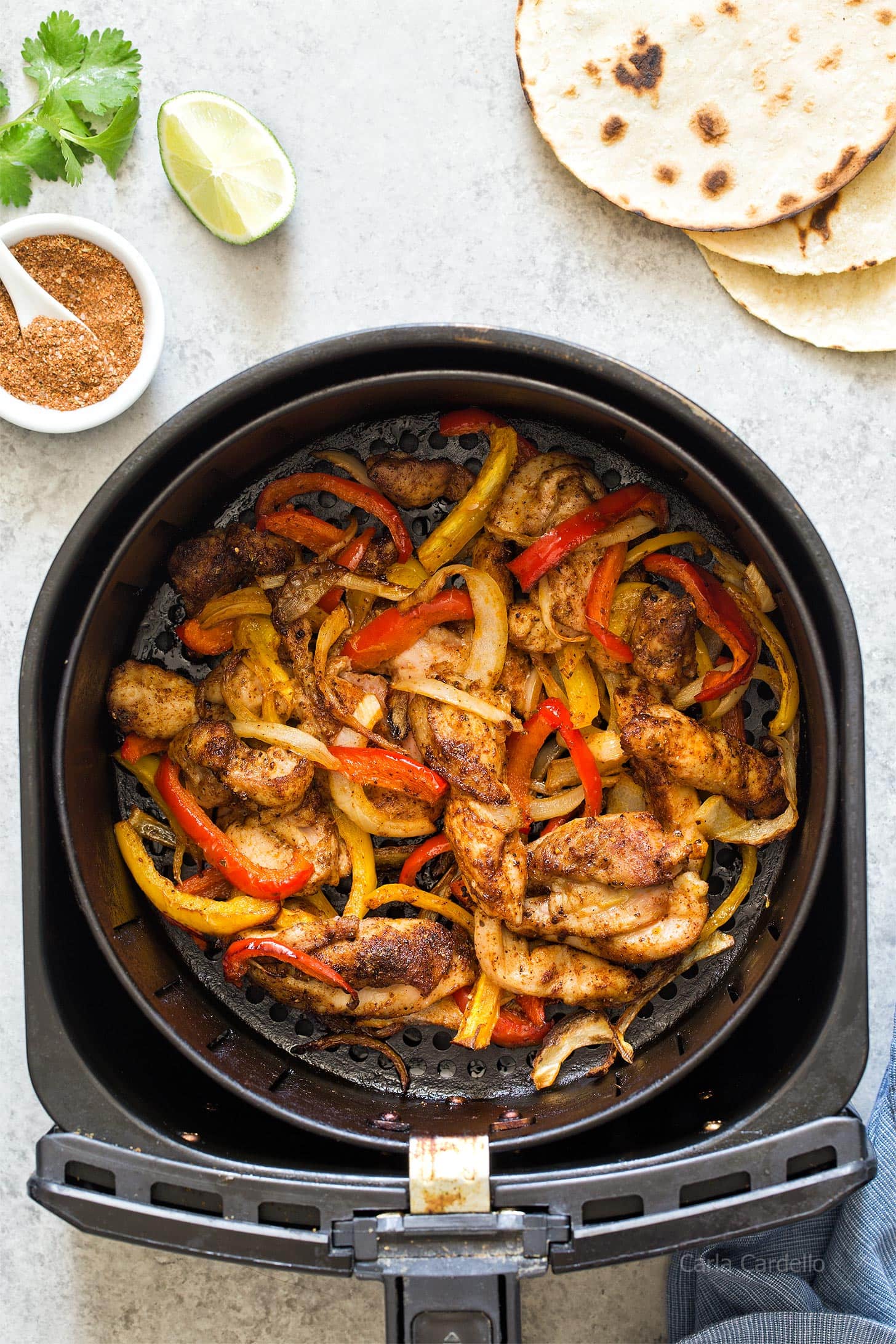 Chicken Fajitas in an air fryer basket