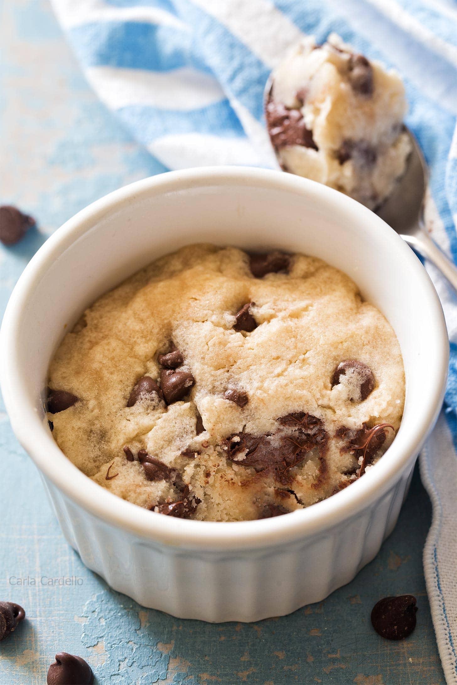 Microwave chocolate chip cookie in a ramekin with bite taken out